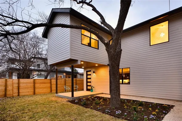 a front view of a house with parking area