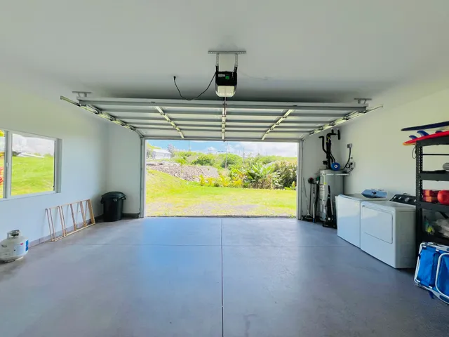 a view of empty room with wooden floor and windows