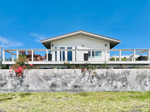 a front view of a house with swimming pool