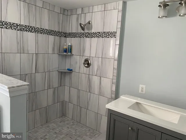 a bathroom with a sink and vanity