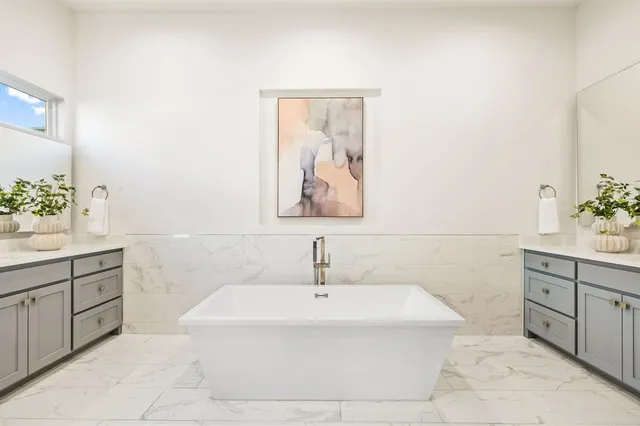 a bathroom with a sink and a bathtub