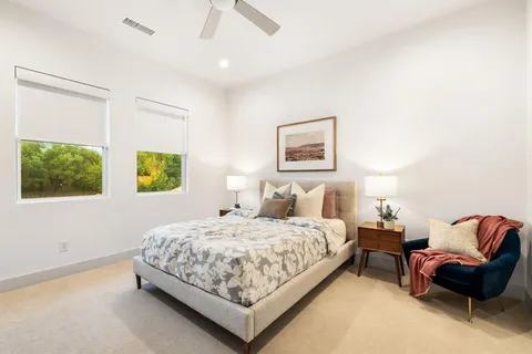 a bedroom with a bed and couch