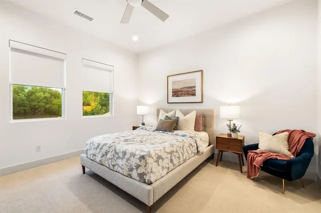 a bedroom with a bed and couch