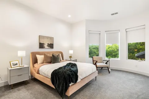 a bedroom with a bed and a couch