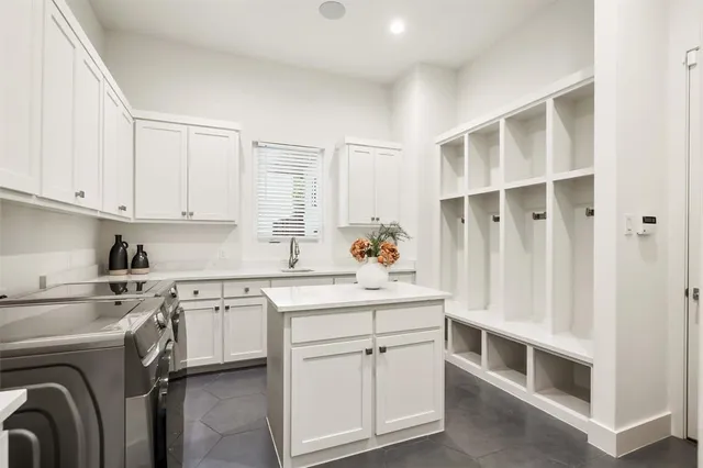 a view of cabinets a washer and dryer