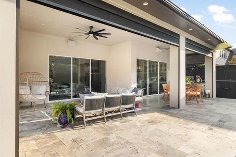 a building outdoor space with patio furniture and potted plant