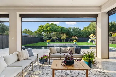 a outdoor living space with furniture and garden view