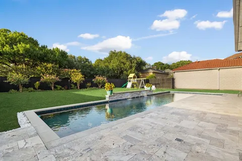 a view of a lake with a house in the background