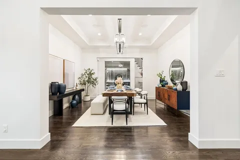 a living room with furniture rug and a window