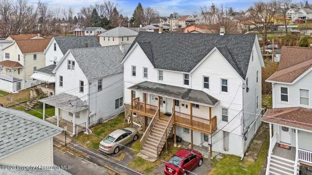 a front view of a house with parking space