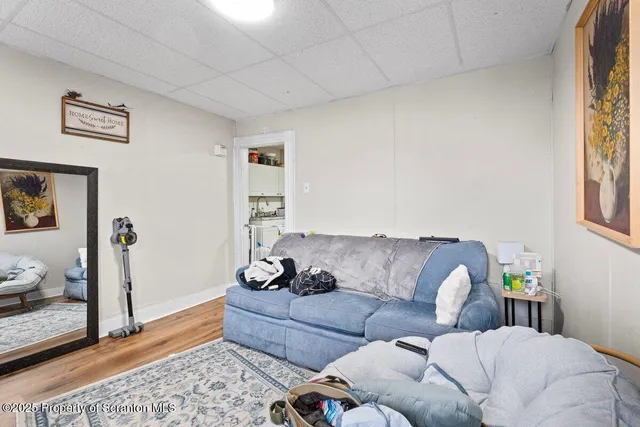 a living room with a bed and furniture