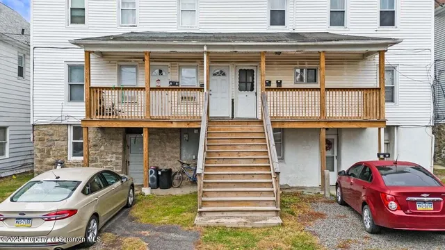 an aerial view of residential houses with city view