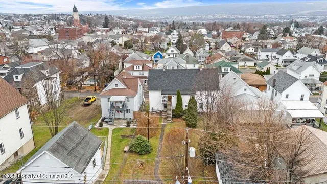 a kitchen with a refrigerator and window