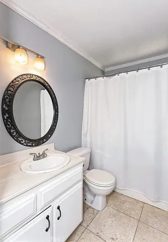 a bathroom with a toilet a sink and a mirror