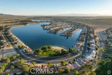 an aerial view of a house with a lake view