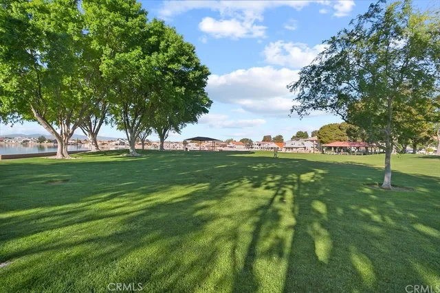 a view of grassy field with benches