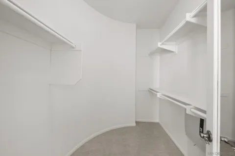 a view of an empty walk in closet