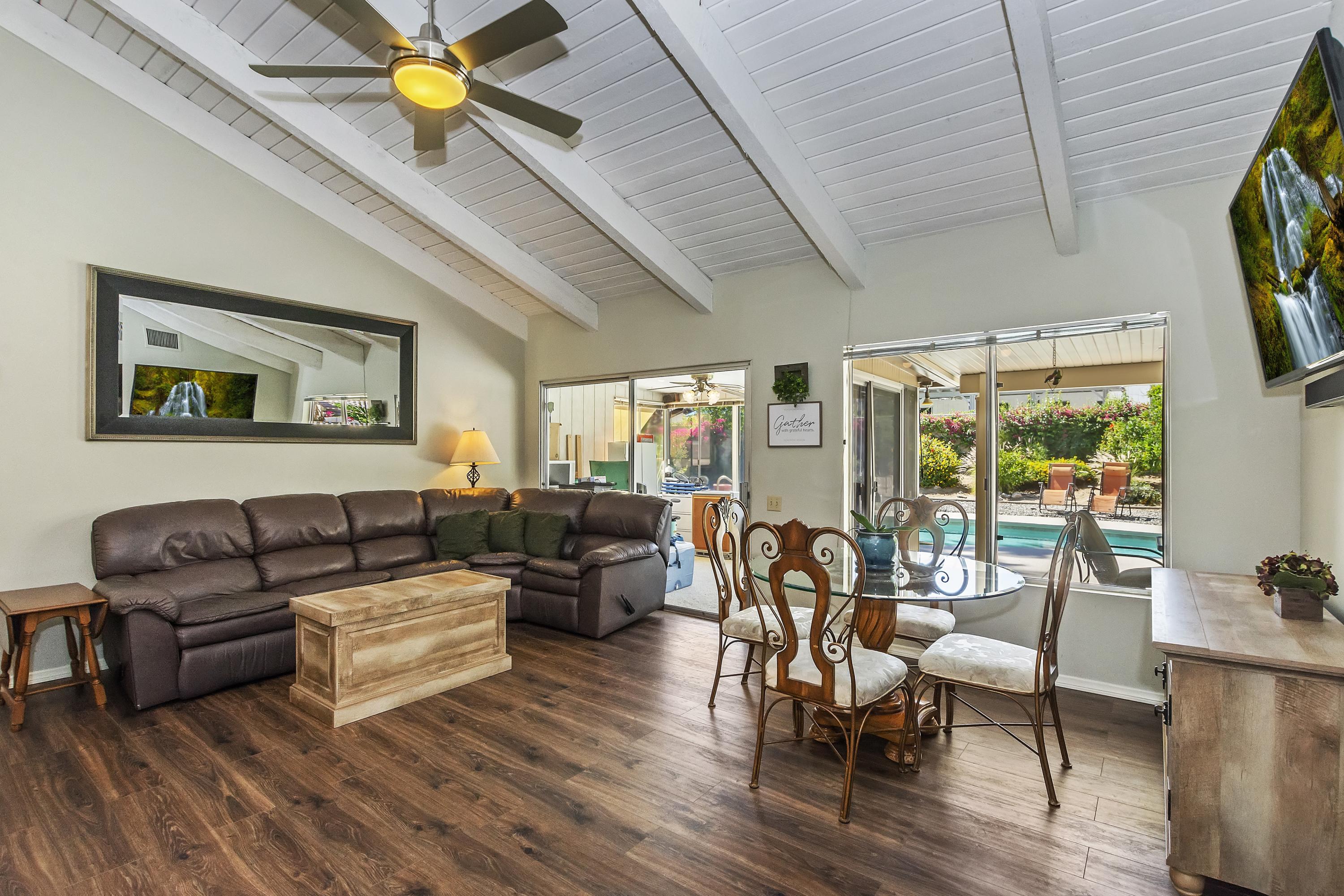 73149 Haystack Road Palm Desert, CA 92260 - Photo 11 of 32 a living room with furniture and a flat screen tv