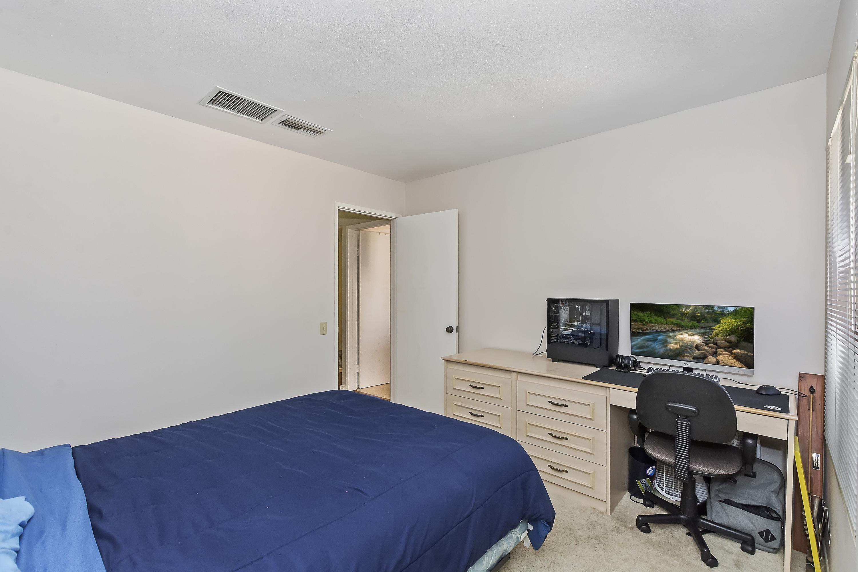 73149 Haystack Road Palm Desert, CA 92260 - Photo 19 of 32 a bedroom with a workspace