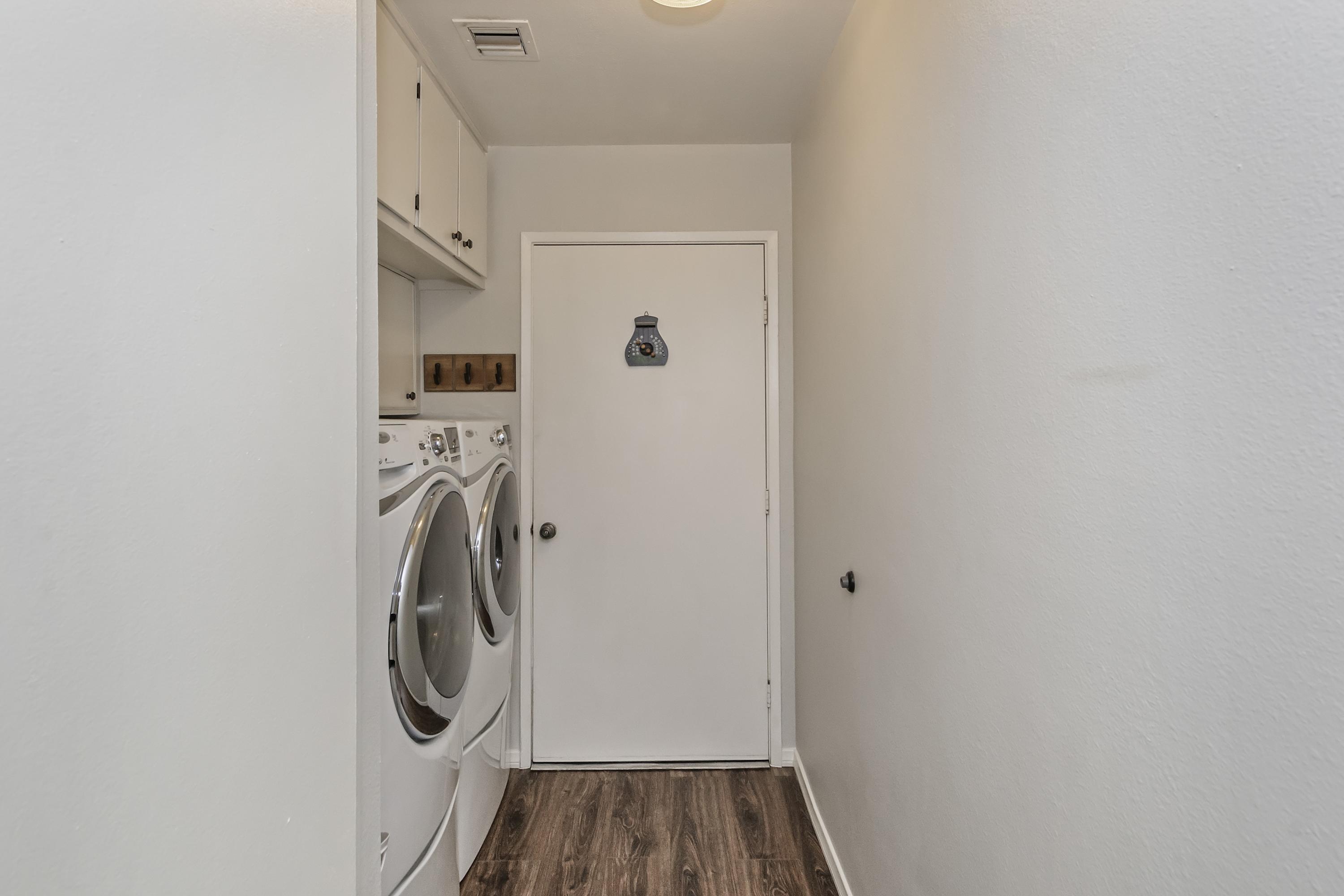 73149 Haystack Road Palm Desert, CA 92260 - Photo 20 of 32 a view of a storage and utility room with washer and dryer