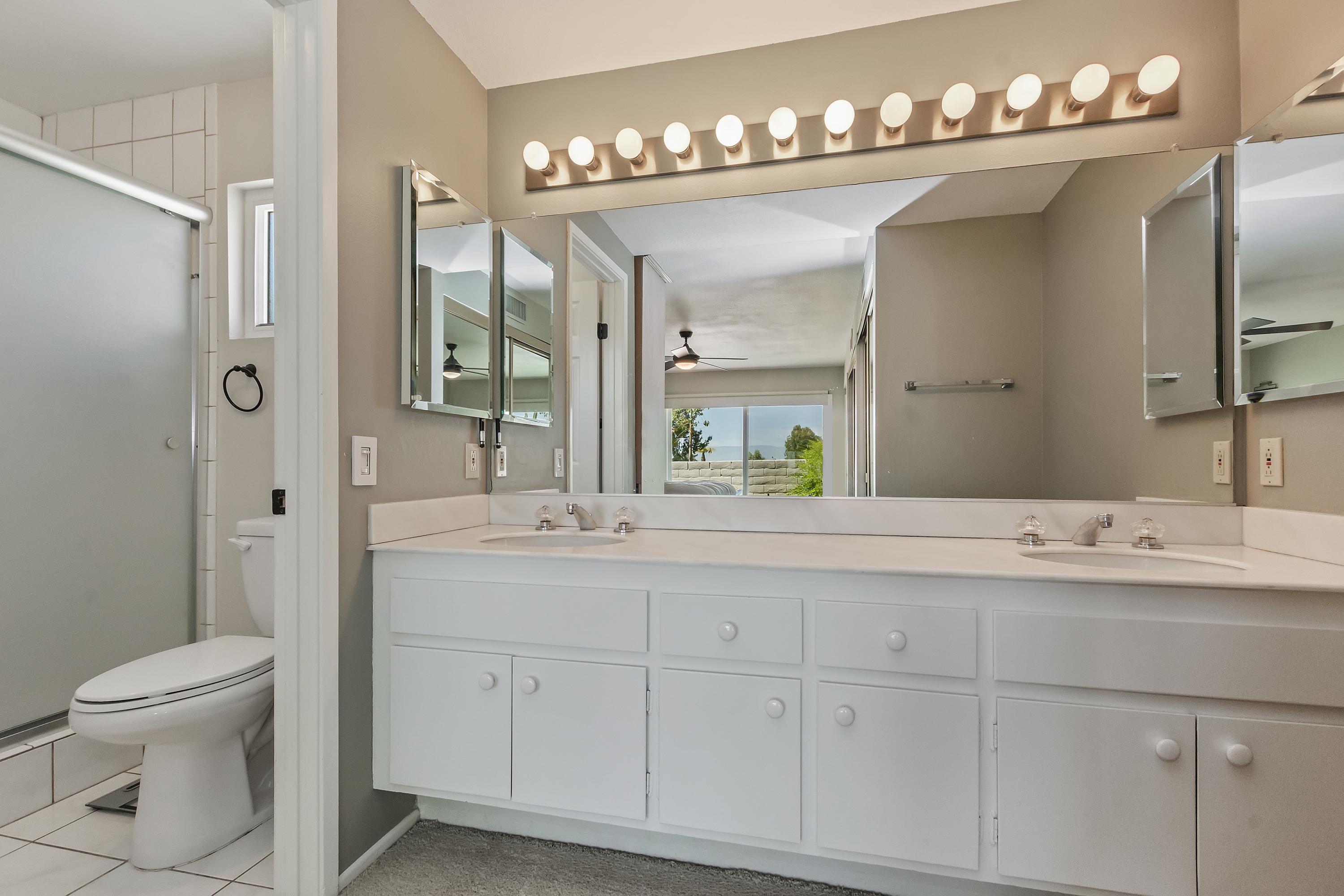 73149 Haystack Road Palm Desert, CA 92260 - Photo 24 of 32 a bathroom with a sink double vanity and a mirror