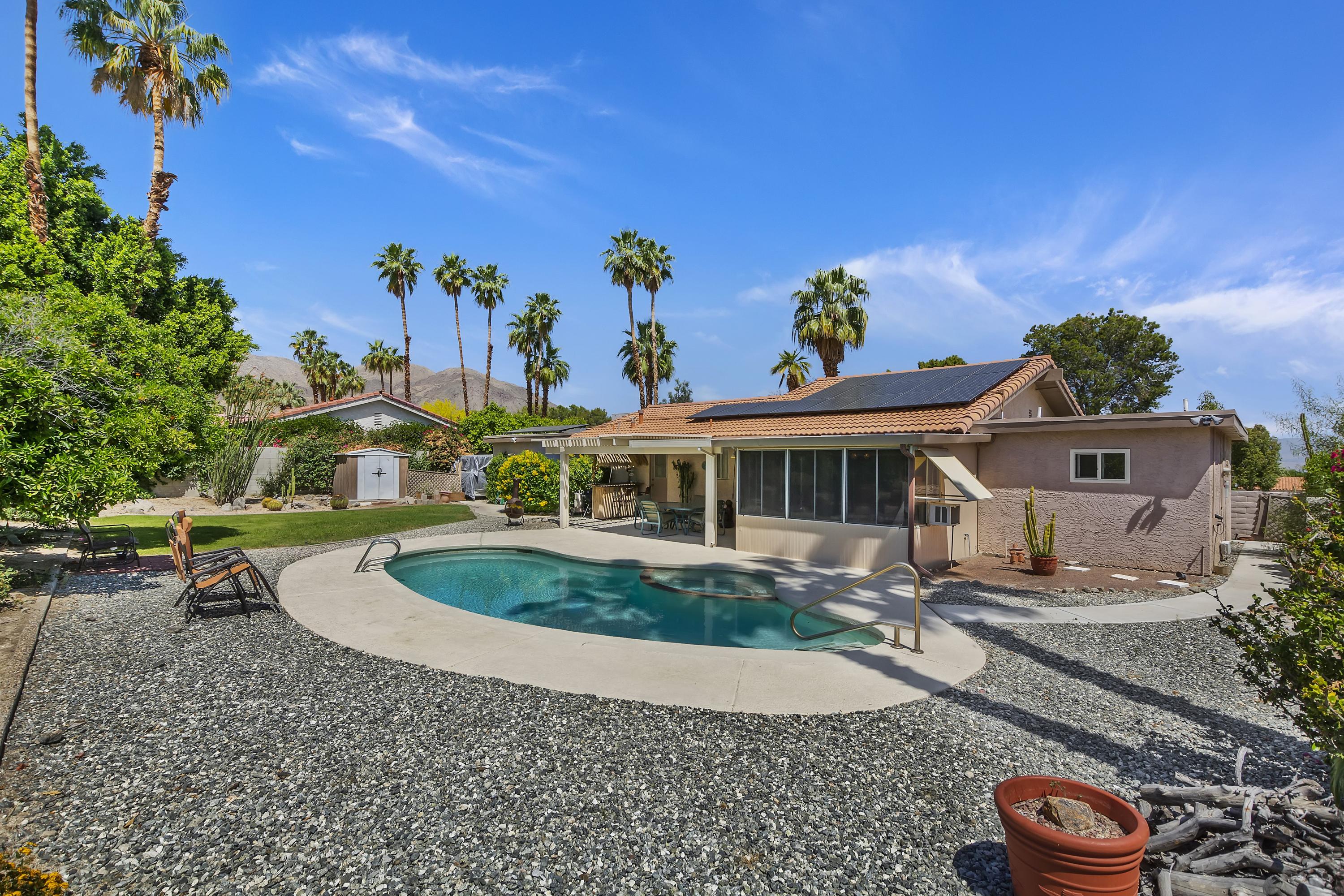 73149 Haystack Road Palm Desert, CA 92260 - Photo 27 of 32 a front view of a house with garden