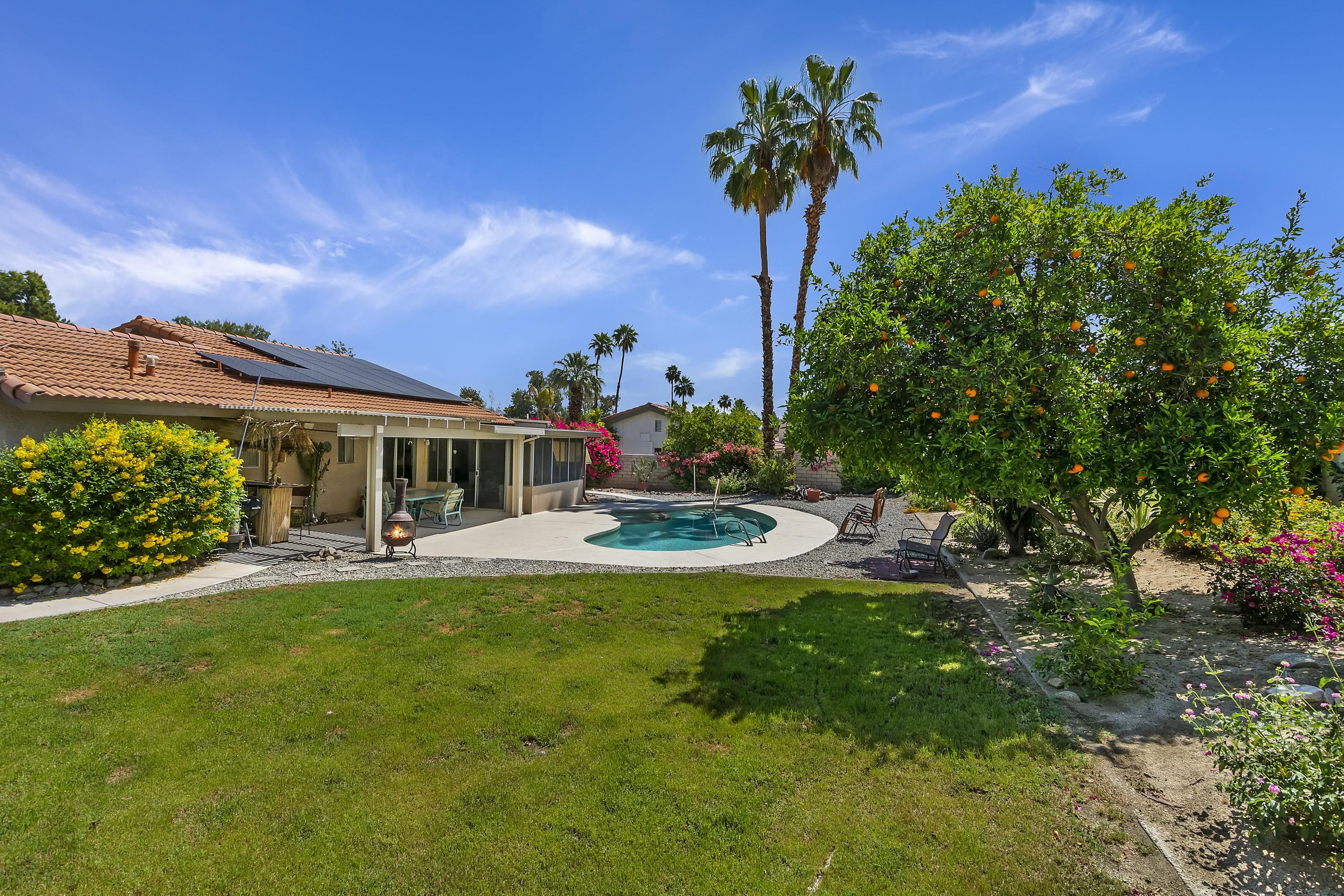 73149 Haystack Road Palm Desert, CA 92260 - Photo 30 of 32 a view of a house with a yard porch and sitting area