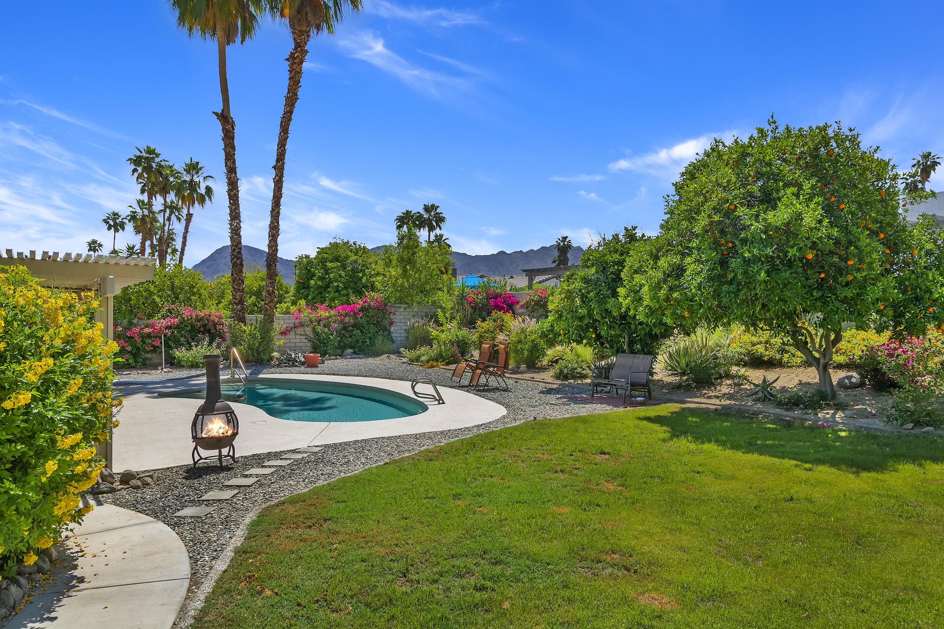73149 Haystack Road Palm Desert, CA 92260 - Photo 31 of 32 a view of a backyard with a garden