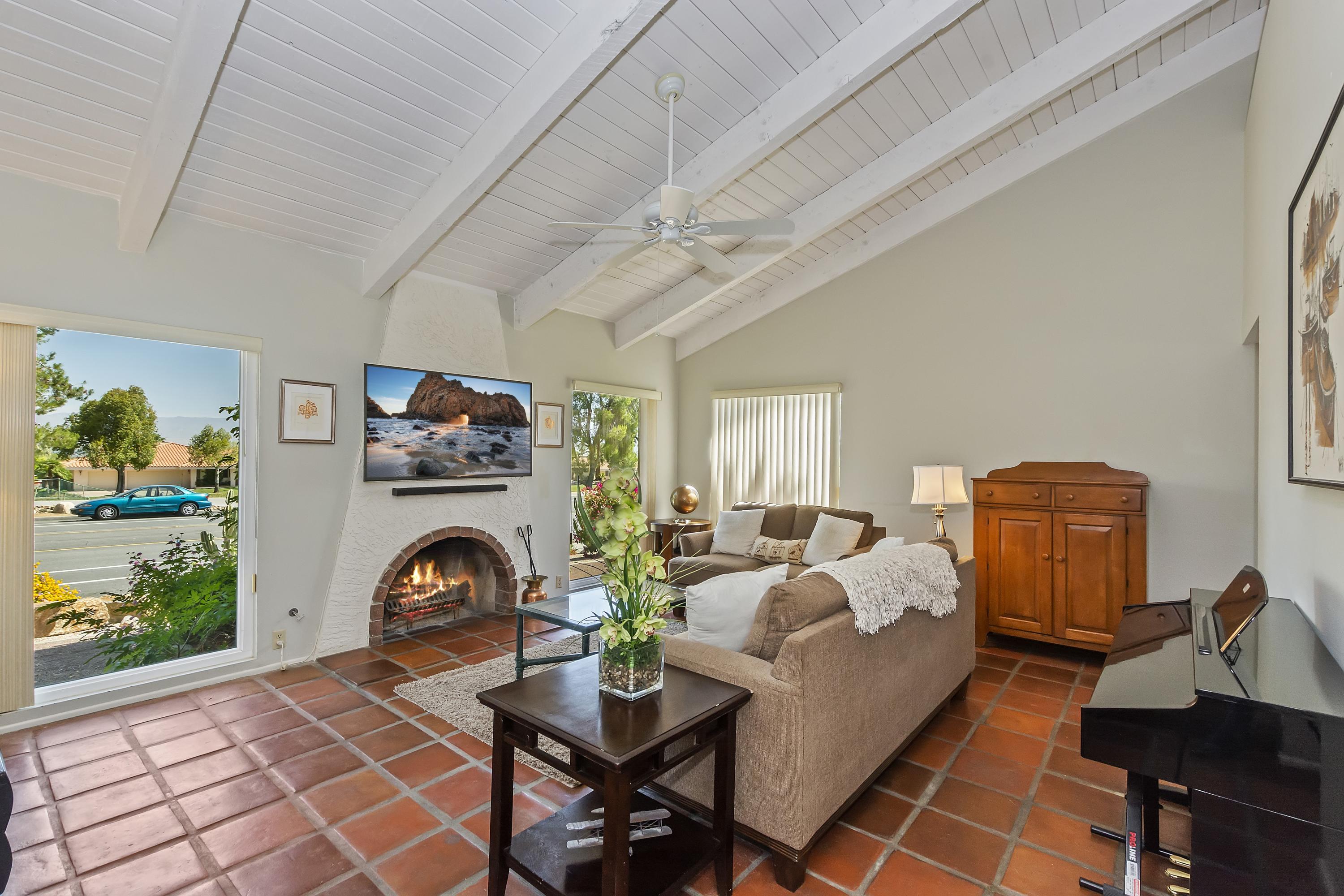 73149 Haystack Road Palm Desert, CA 92260 - Photo 5 of 32 a living room with furniture and a fireplace