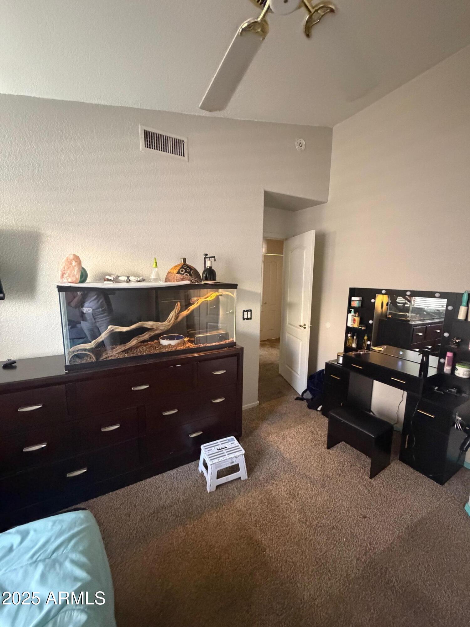 112 West Smoke Tree Road Gilbert, AZ 85233 - Photo 26 of 37 a living room with furniture and a air conditioner vent