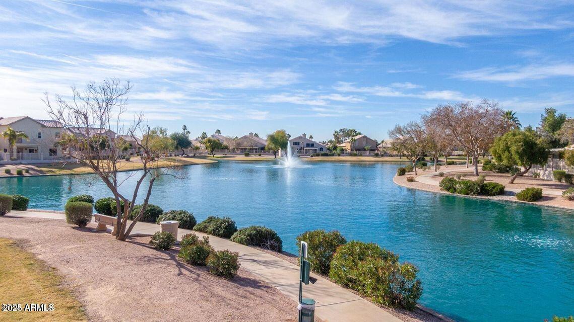 112 West Smoke Tree Road Gilbert, AZ 85233 - Photo 36 of 37 a view of a lake with couches and city view