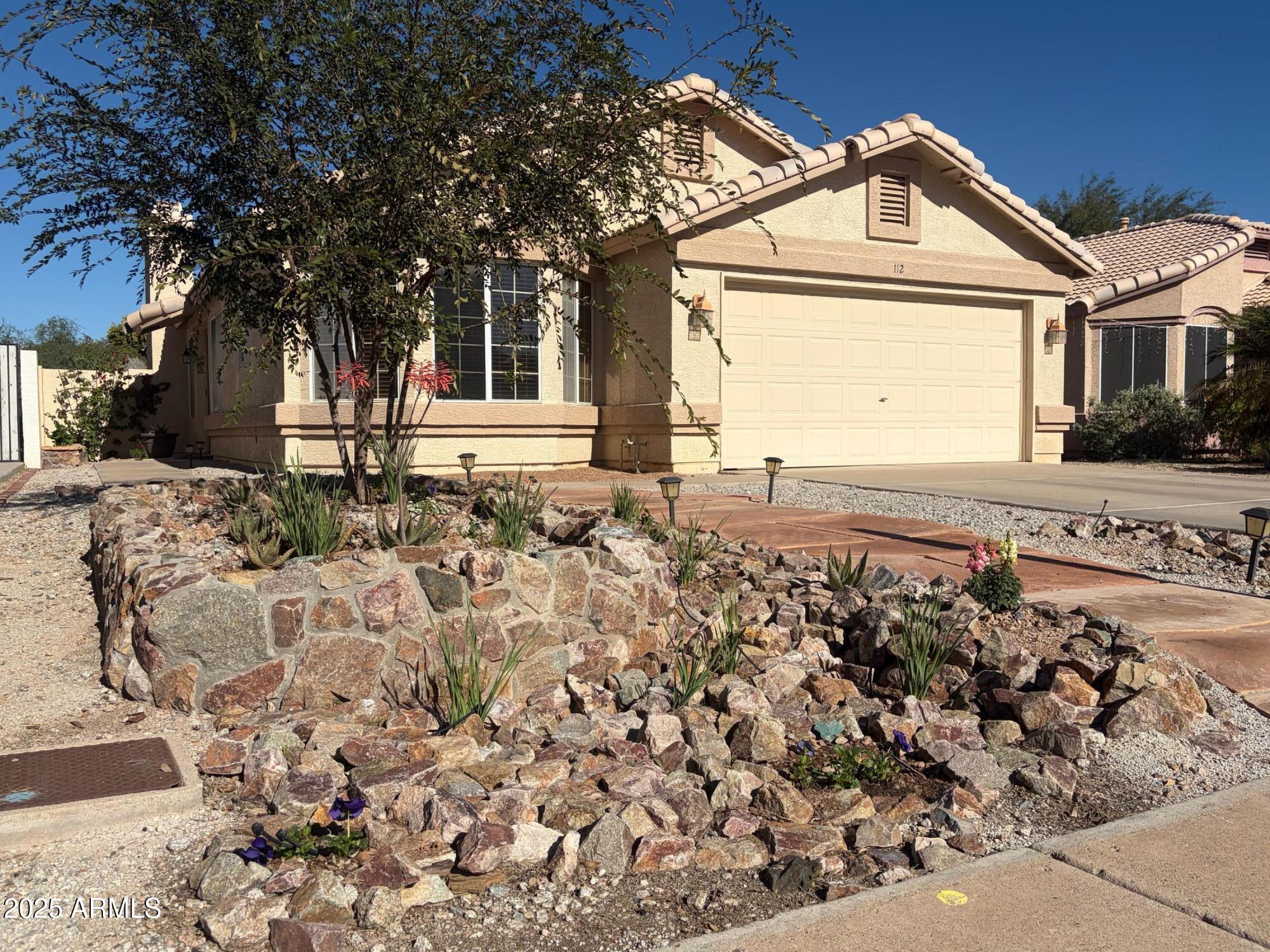 112 West Smoke Tree Road Gilbert, AZ 85233 - Photo 5 of 37 a front view of a house with a yard