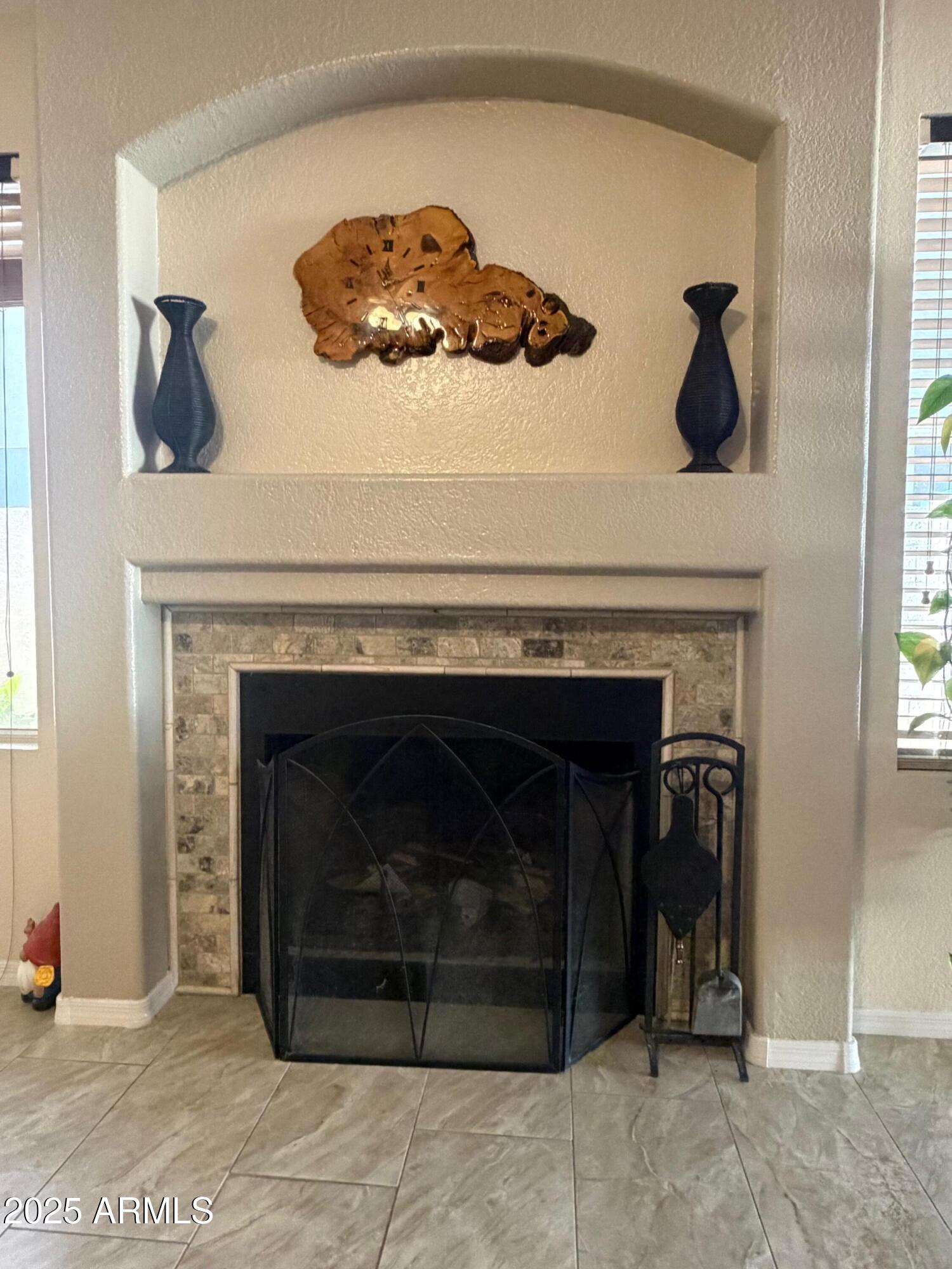 112 West Smoke Tree Road Gilbert, AZ 85233 - Photo 8 of 37 a close view of a fireplace with a fireplace