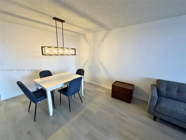 a view of a livingroom with furniture and a table