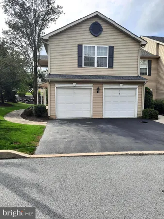 a front view of house with yard