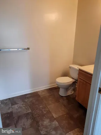 a white toilet sitting in a bathroom