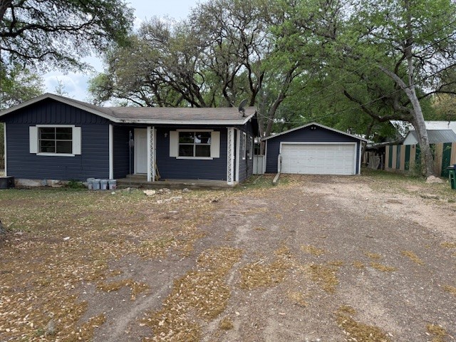 10314 Old Manchaca Road Austin, TX 78748 - Photo 1 of 1 View of front of property with an outbuilding, a garage, and a porch