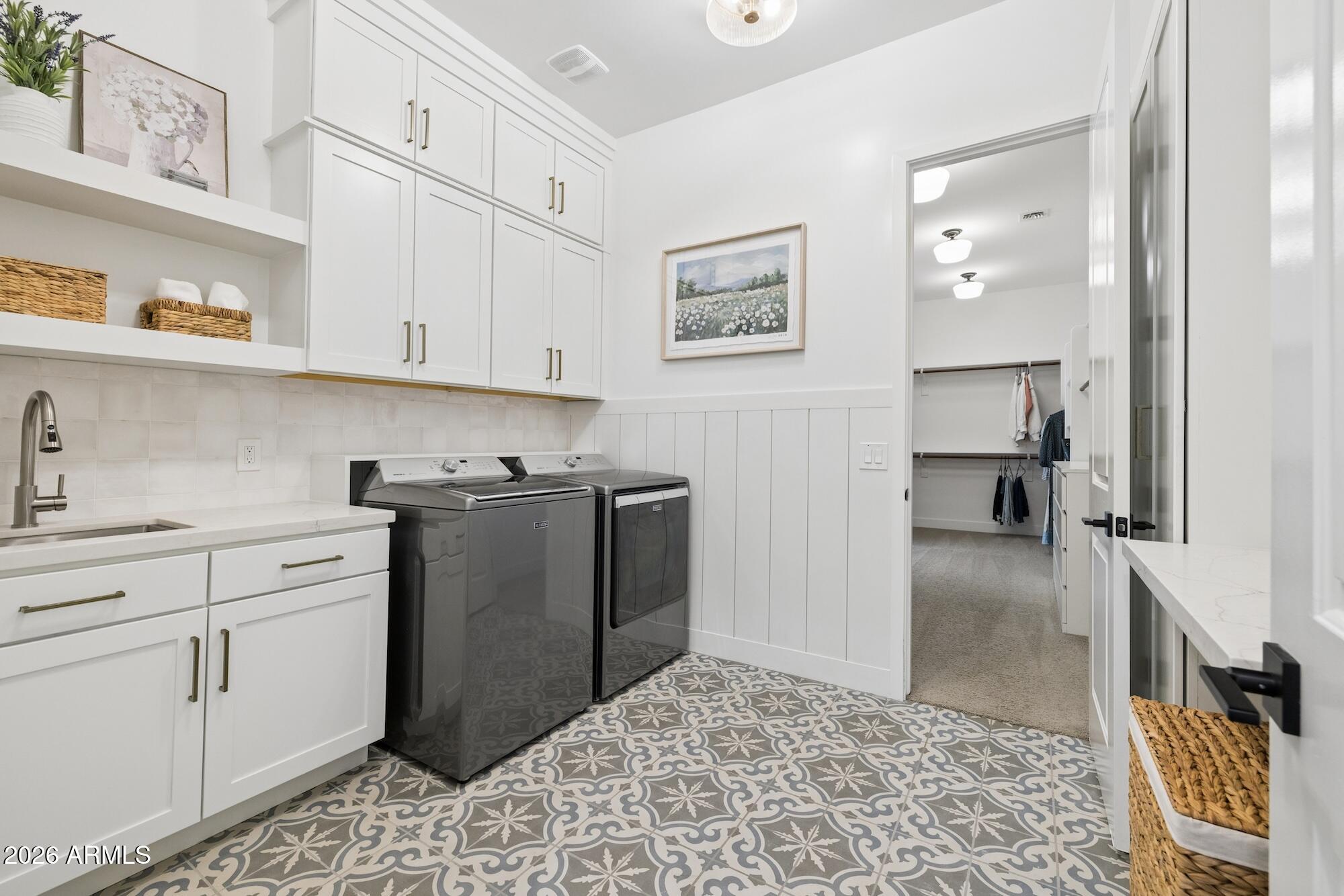 2633 East Geronimo Street Gilbert, AZ 85295 - Photo 30 of 75 a kitchen with cabinets and wooden floor