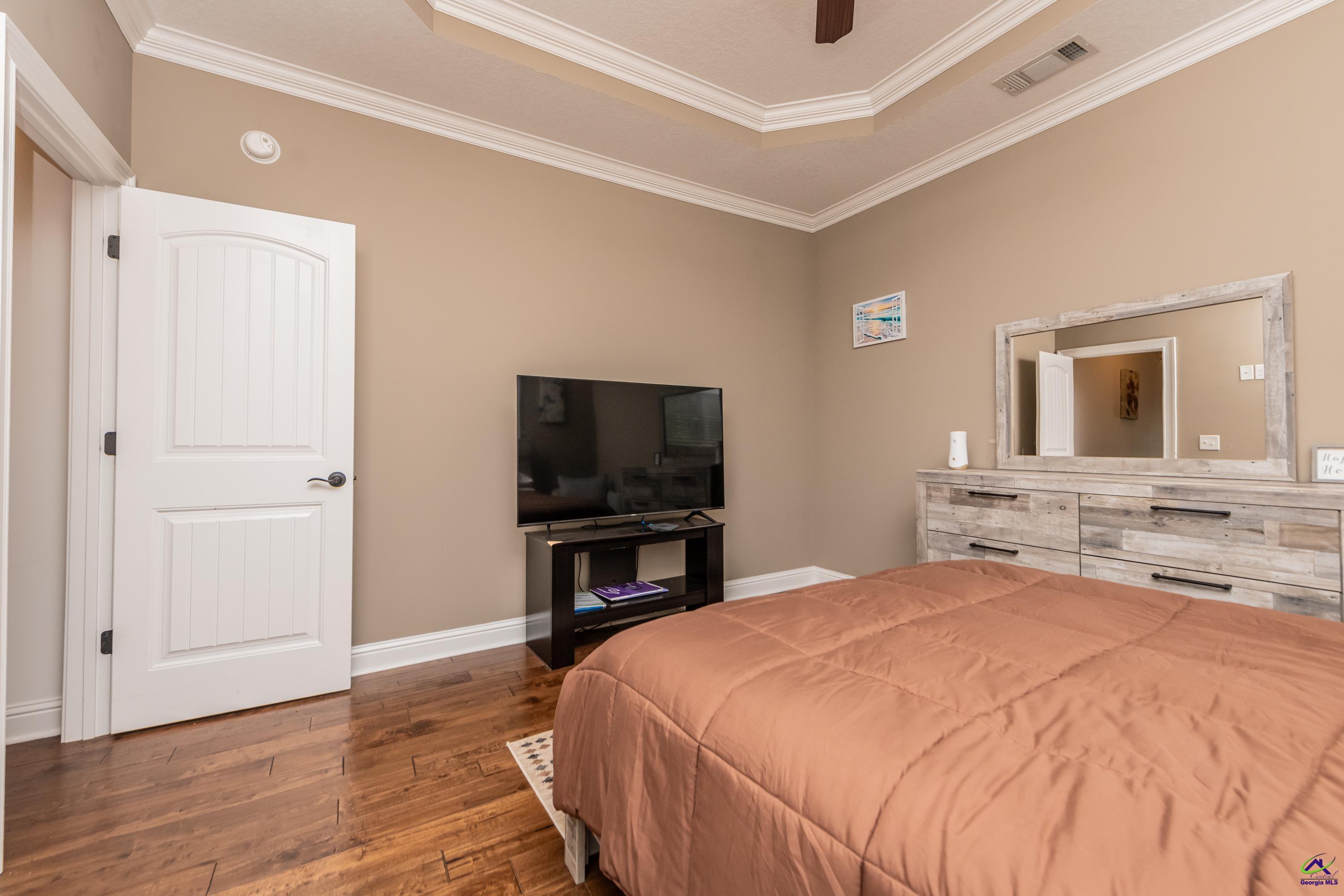405 Old Bridge Road Warner Robins, GA 31088 - Photo 36 of 58 a bedroom with a bed and a flat screen tv