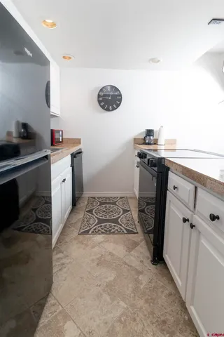 a kitchen with a sink and a stove