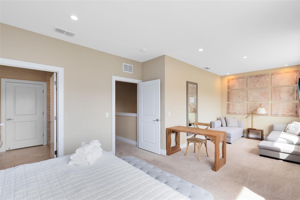 3061 Rockefeller Way Kissimmee, FL 34747 - Photo 13 of 38 a bedroom with furniture and a large window