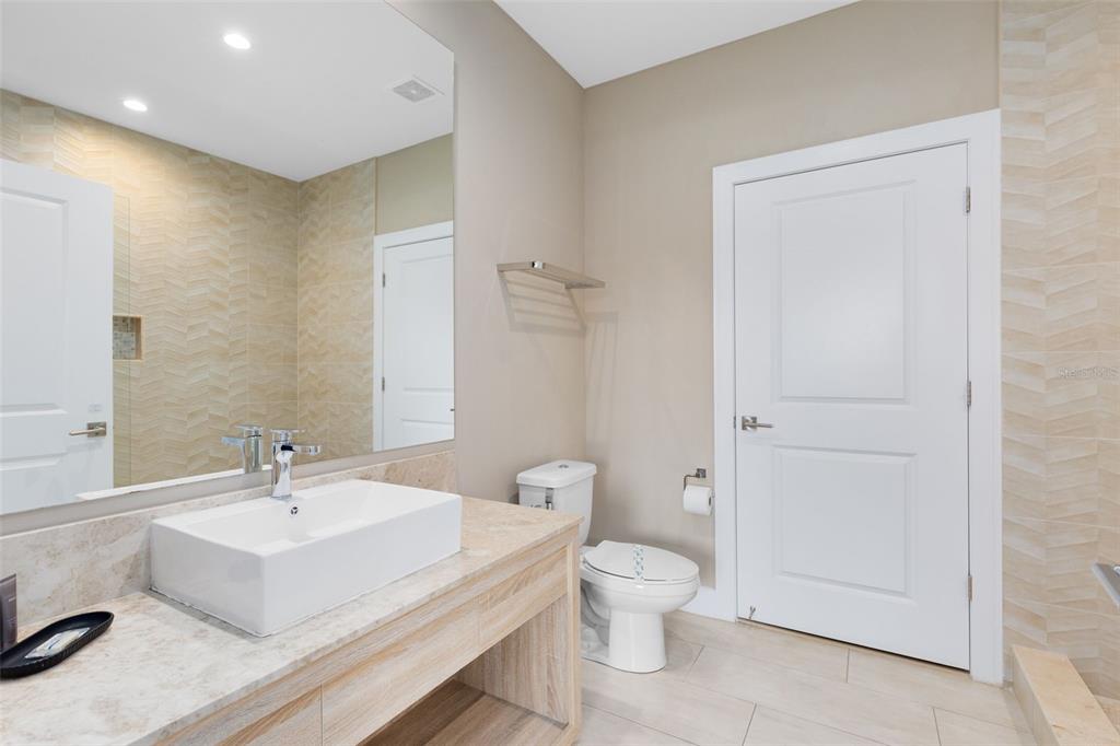 3061 Rockefeller Way Kissimmee, FL 34747 - Photo 20 of 38 a white toilet sitting next to a bathroom sink