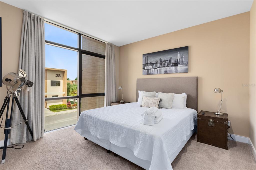 3061 Rockefeller Way Kissimmee, FL 34747 - Photo 21 of 38 a bedroom with a bed and a table