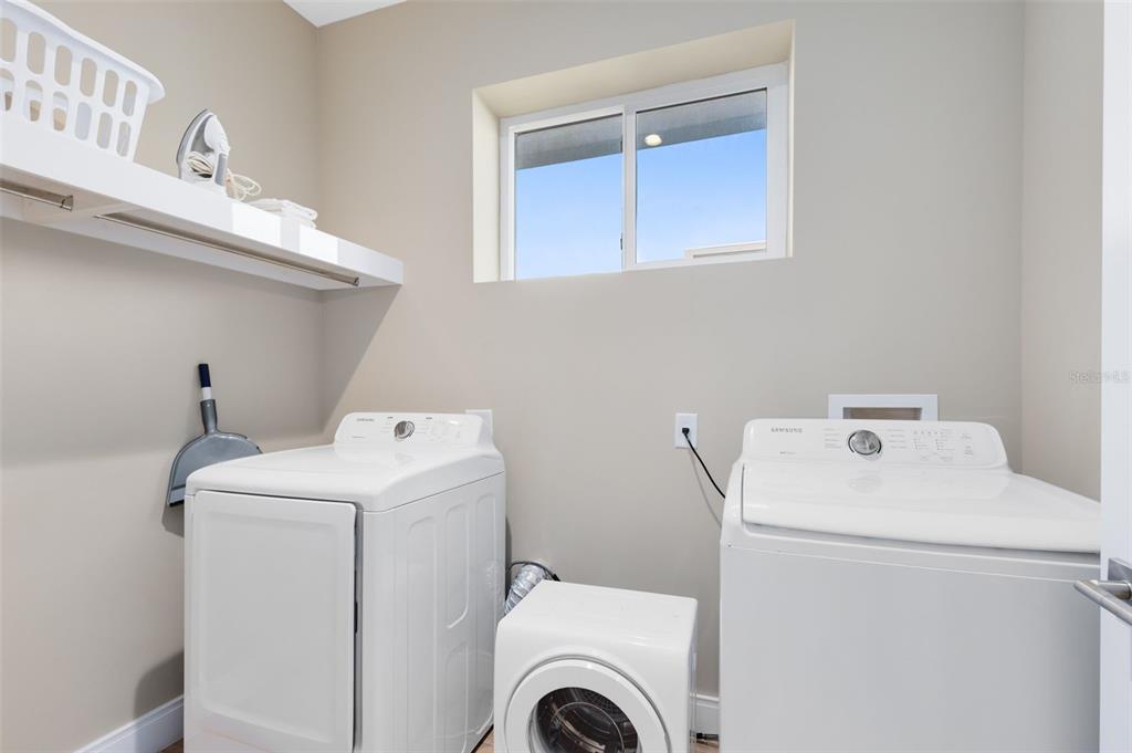 3061 Rockefeller Way Kissimmee, FL 34747 - Photo 25 of 38 a utility room with dryer and washer