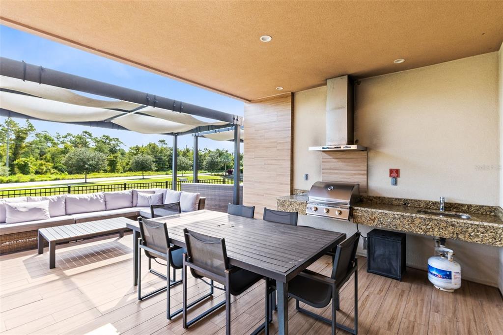 3061 Rockefeller Way Kissimmee, FL 34747 - Photo 27 of 38 a dining room with furniture and a floor to ceiling window