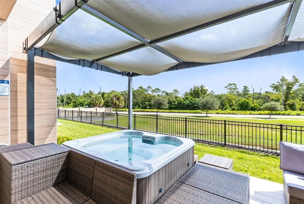 3061 Rockefeller Way Kissimmee, FL 34747 - Photo 29 of 38 a view of a patio with a table chairs