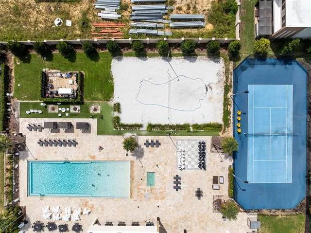 a view of swimming pool with a yard