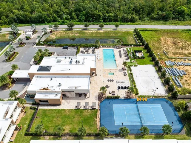 an aerial view of a house with a swimming pool