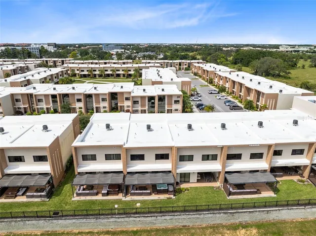 front view of a brick house with a small yard