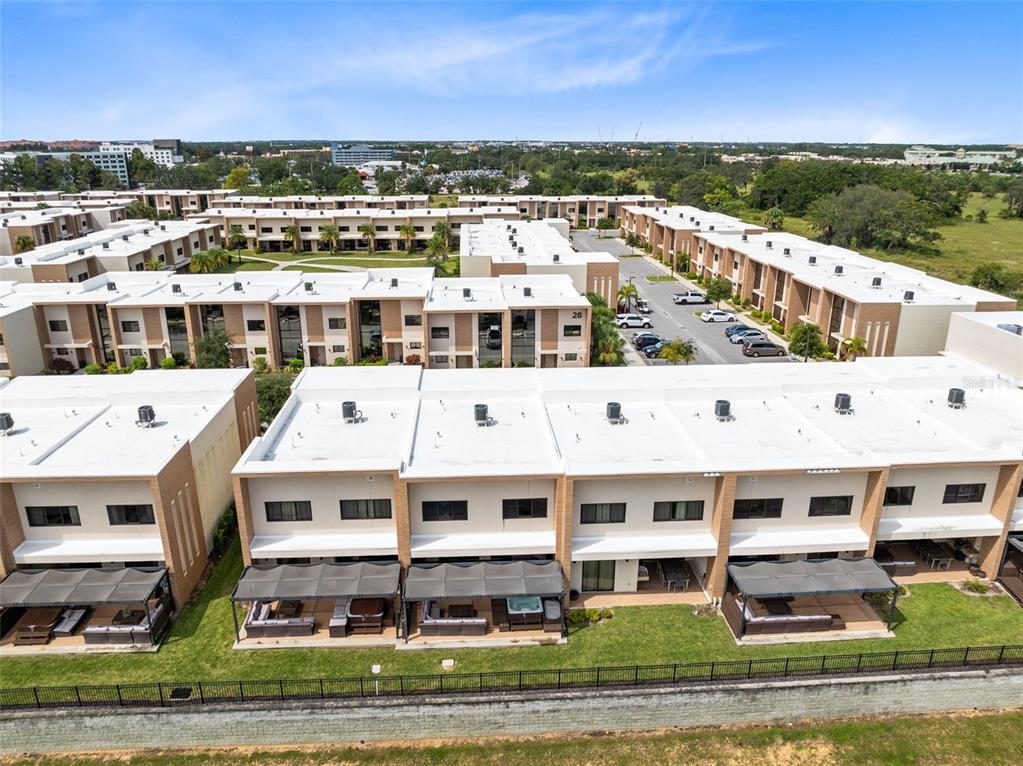 3061 Rockefeller Way Kissimmee, FL 34747 - Photo 36 of 38 a large building with a view of big yard